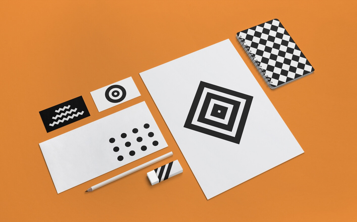 orange background. black and white papers.
